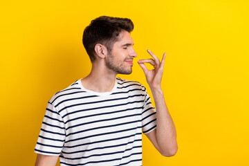 Profile photo of satisfied young person closed eyes arm fingers demonstrate gourmet gesture isolated on yellow color background