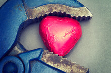 Wrench Holding A Chocolate Heart