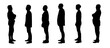 © curto - silhouette of a group of man standing seen from the side on a white background