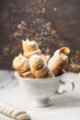 Pastry Tubes with Whipping Cream in the White Cup
