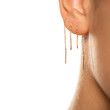 © vladimirfloyd - Female ear with three ear chaines.
