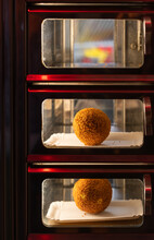 Eierbal In Vending Machine, Dutch Fried Snack Popular At The North Of The Country Which Consists Of Hard-boiled Egg, Ragout And Breadcrumbs. Selective Focus