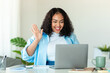 © Prostock-studio - Online meeting concept. Happy black body positive lady using laptop for virtual conferencing, having video call at home