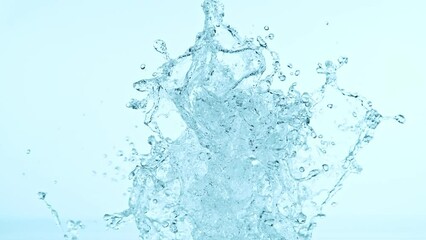 Poster - Super slow motion of splashing water isolated on blue background. Filmed on high speed cinema camera, 1000fps.