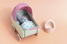 Miniature Vintage Baby Stroller With A Little Bunny And Potty. Toys For Kids. High Quality Photo