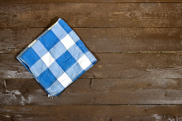 Sticker - top view of Empty wooden table with plaid tablecloth 