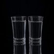 © Алексей Доненко - shot glasses with vodka on a black background