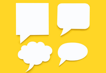 Set of paper speech bubbles on a yellow background. Flat chat icons in the form of speech bubbles of various shapes. Free space for text or image. Signs of verbal communication