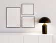 © Thomas_Blender - Bright living room interior with empty white pictures in the frame, scandinavian room, wall and dresser with lamp