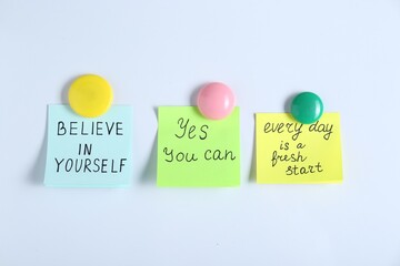 Wall Mural - Notes with motivational quotes on white background, flat lay