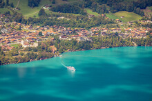 Aerial View Of Swiss Alps And Lake Brienz With Ferry Boat At Sunset, Interlaken