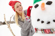 © Grady R/peopleimages.com - Snowman, woman and happy at Christmas on winter break in Canada countryside and female building with snow for outdoor holiday tradition. Smile with nature, happiness and celebrate with festive spirit