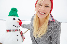 Portrait, Snow And Woman Building A Snowman From Sweden In Winter Happy About Holiday. Female Face With Happiness And Christmas Excitement On Vacation Outdoor For Holidays Travel In Nature