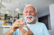 © Graphicroyalty - Senior man drink water from glass. Good health, lifestyle.