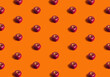 Fall flat lay pattern made with ripe apple fruit on orange background. Minimal concept with sowt shadows