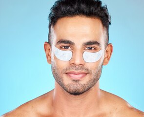 Sticker - Beauty, eye patch and face with man and eye care, cosmetic treatment portrait with healthy skin against blue studio background. Dermatology, cosmetics mockup and skin care with grooming and facial.