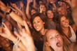 © Arcurs Co-op/peopleimages.com - Fans, audience and people at concert, music festival and band performance with happy energy while dancing at celebration for new years. Women crowd excited and crazy at event for live show at club