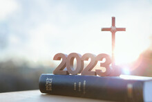 2023 New Year Rising Sun And Sunrise And Cross Of Jesus Christ And Holy Bible
