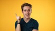 Portrait of thinking, smart puzzled pensive young hipster man 20s looks around thinks comes up with ideas raised finger isolated on yellow background studio portrait