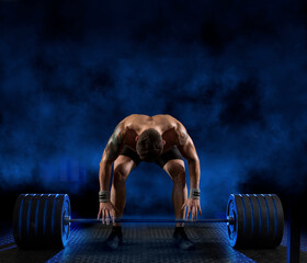 Wall Mural - Muscular man workout with barbell