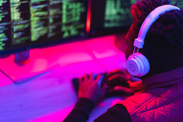 Software developer coding on his computer. Coding and hacking concept...