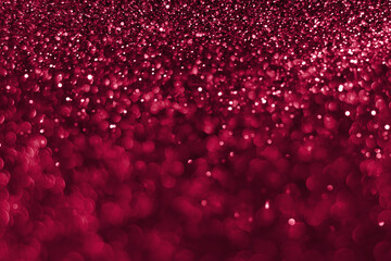 Trendy viva magenta, pink sparkling glitter bokeh background, abstract defocused texture. Holiday lights. Color of the year 2023