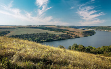 Fototapete - Scenic panorama view of Dnister River in Ukraine. Incredible nature landscape. Amazing autumn scenery. Majestic calm river and perfect sky over Dnister canyon of Ukraine. Popular touristic landsmarks