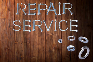 Wall Mural - Repair service text made of screws and nut on the wooden background.