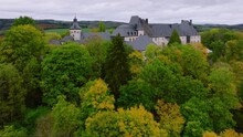 Wiltz, Luxembourg. Aerial Shot At Autumn Of Wiltz Castle. Cloudy Weather Drone Footage