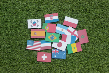 Wall Mural - Leather soccer ball with international team flags of the participating countries in the championship tournament isolated on white background. Football equipment competitive game. World cup concept.	