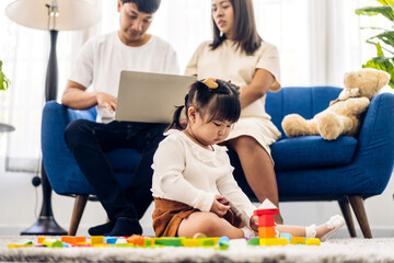 Wall Mural - Portrait of enjoy happy love asian family father and mother with little asian girl smiling activity learn and skill brain training play with toy build wooden blocks board education game at home