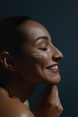 Wall Mural - Young beautiful happy woman applying cream on her face