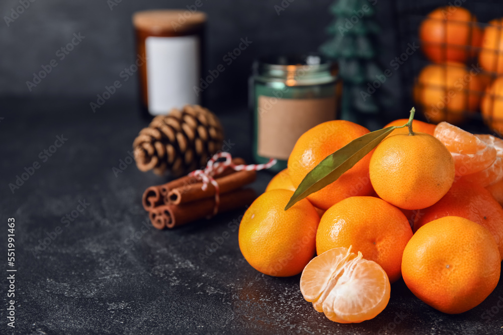 Heap of fresh ripe tangerines on dark background