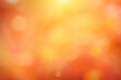 Natural background blurring warm colors and bright sun light. Bokeh or Christmas background Green Energy at sky sunny color orange light patterns plain abstract flare evening clouds blur.	
