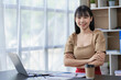 © ArLawKa - Asian businesswoman working with laptop computer Calculate, analyze, young woman, financial advisor, prepare statistical report, study documents, check financial charts in the office.