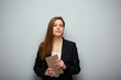 © Yuriy Shevtsov - Serious woman teacher holding book. Isolated portrait with copy space.