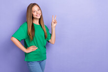 Photo Of Positive Cheerful Pretty Lady Dressed Stylish Clothes Demonstrate V-sign Stand Empty Space Isolated On Purple Color Background