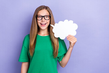 photo of positive pretty pupil learner wear green clothes hold white paper card tell news empty spac