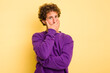 © Asier - Young smart caucasian man on yellow background scared and afraid.