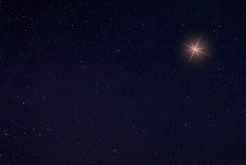 Wall Mural - Single bright star in the sky on Christmas Eve