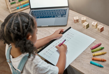 Child, laptop and math homework while writing in a notebook for online learning at home. Elearning, digital education and mathematics lesson with distance education for little girl using the internet