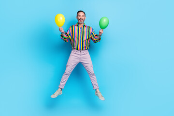 Poster - Full length photo of positive retired bearded man preparing concert event disco hold two helium balloons isolated on blue color background