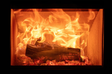 Canvas Print - Fire flames and burning wood logs, energy stove fireplace close up,