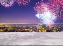 Beautiful White Marble Table Or, Little Shiny Surface, Perspective View, Background Of Blurred Cityscape And Sky Full Of Fireworks At Night. Empty Space For Products To Put On The Table.