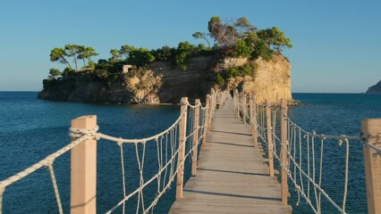 Wall Mural - Wooden footbridge leading to the small Cameo island, Zakynthos, Greece. 