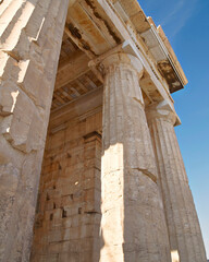 Wall Mural - A partial view of Parthenon ancient temple and clear blue sky as a background. Acropolis of Athens, Greece.