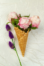 Ice Cream Cone With Flowers And Purple Clover. Vertical Shot White Background.