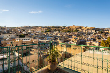 Wall Mural - Old historic downtown called medina seen from rooftop terrace in the heart of Fez, Morocco.