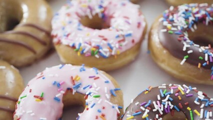 Canvas Print - Variety of store-bought doughnuts in a white paper box.