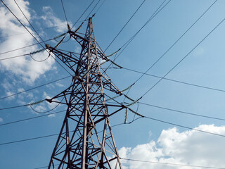 Wall Mural - High-voltage power transmission tower connecting multiple lines.